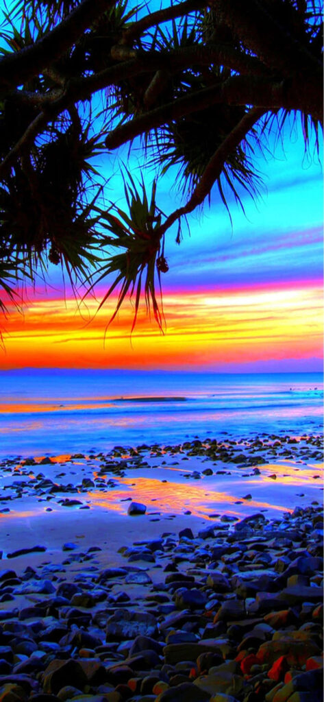 Stunning Sunset Rocky Beach Wallpaper: Vibrant Colors & Serenity