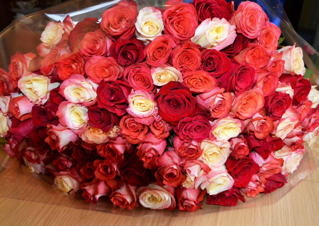 Stunning Rose Bouquet Wallpaper: Vibrant Red, Pink & Cream Background