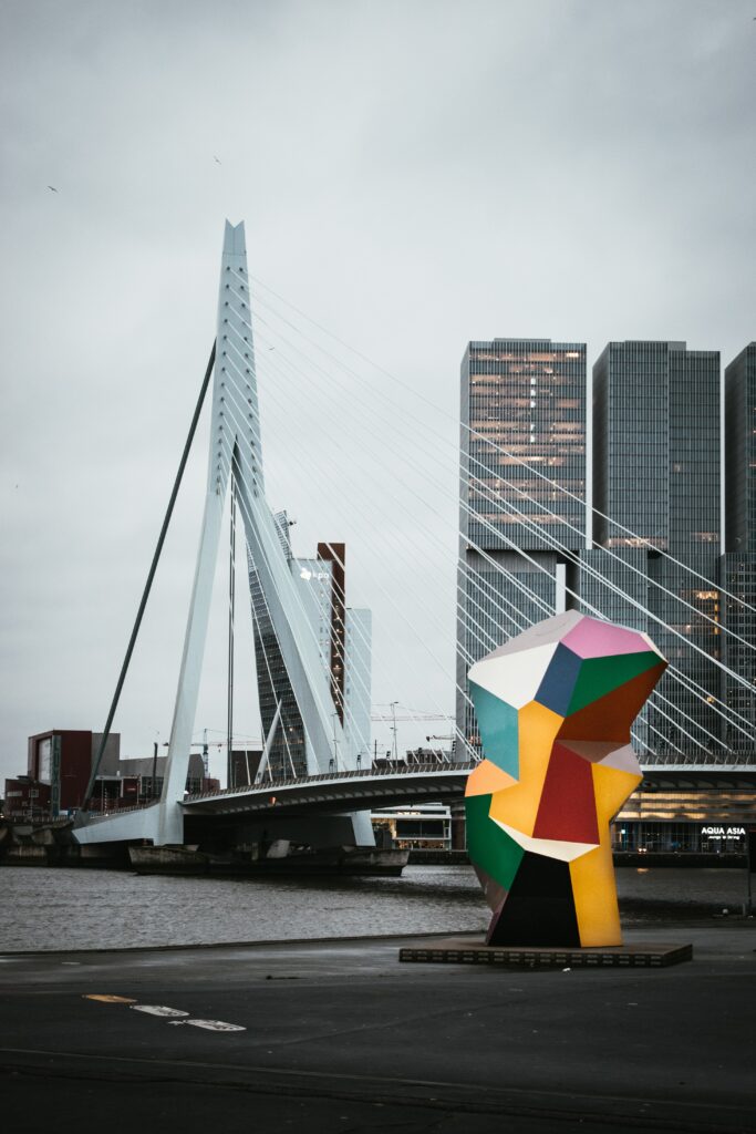 Rotterdam Wallpaper: Iconic Erasmus Bridge & Colorful Sculpture Design