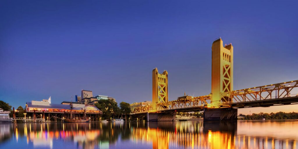Golden Glow: Sacramento Tower Bridge Night View Wallpaper
