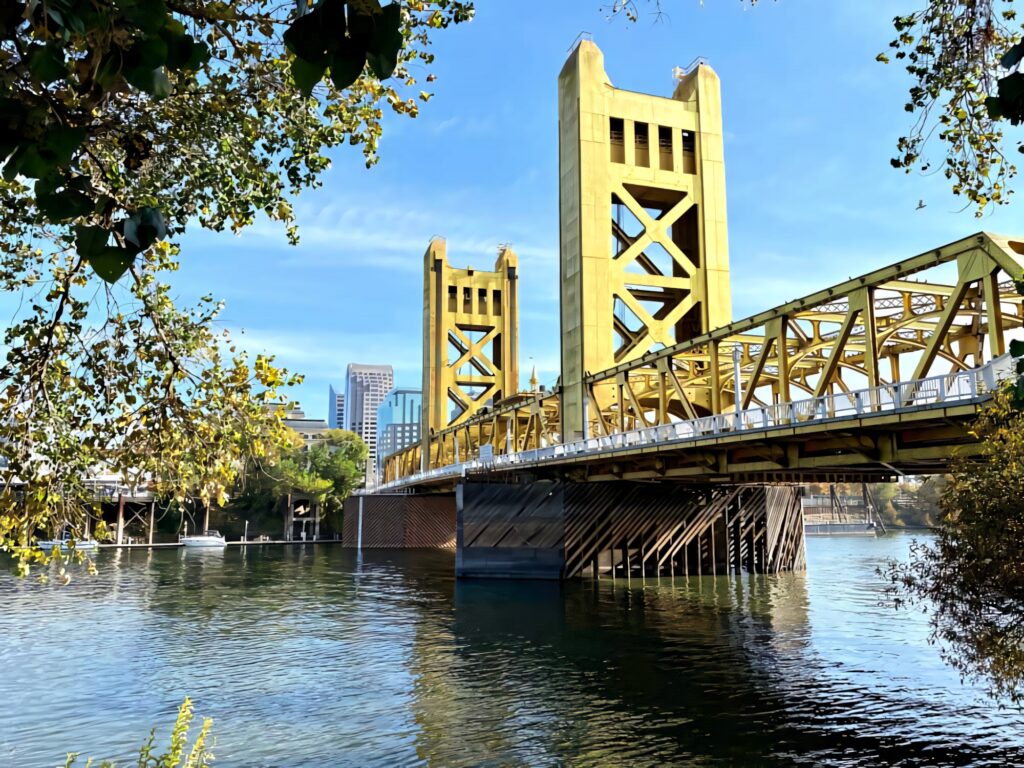 Serene Sacramento Tower Bridge: Golden Icon with Scenic Wallpaper