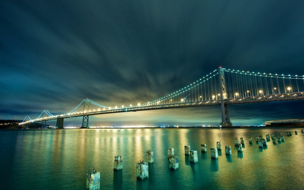 Stunning San Francisco Bay Bridge Night Wallpaper: Serene Cityscape
