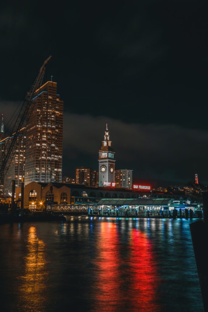 Serene San Francisco Waterfront Night Wallpaper with Iconic Clock Tower