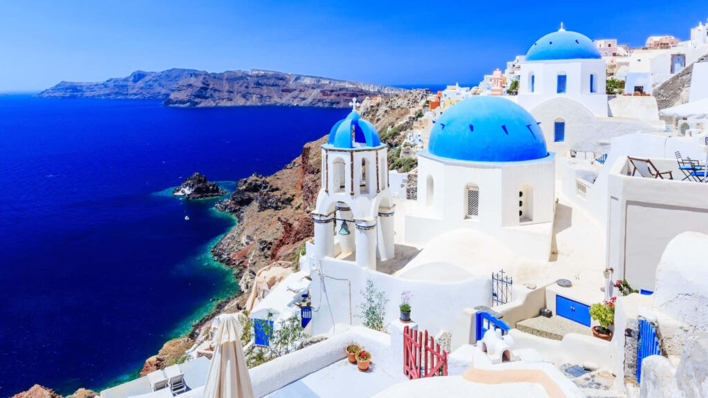 Stunning Santorini Wallpaper: Iconic Whitewashed Buildings & Blue Domes