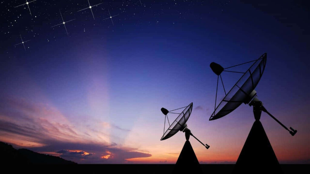 Stunning Satellite Dishes Wallpaper: Technology Meets Starry Sunset