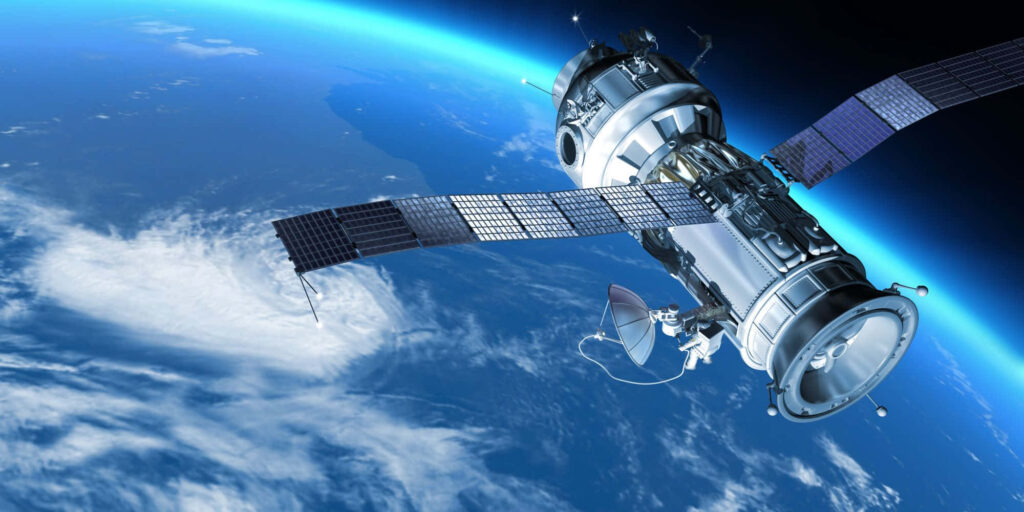 Stunning Satellite Orbiting Earth: Solar Panels & Wallpaper Background