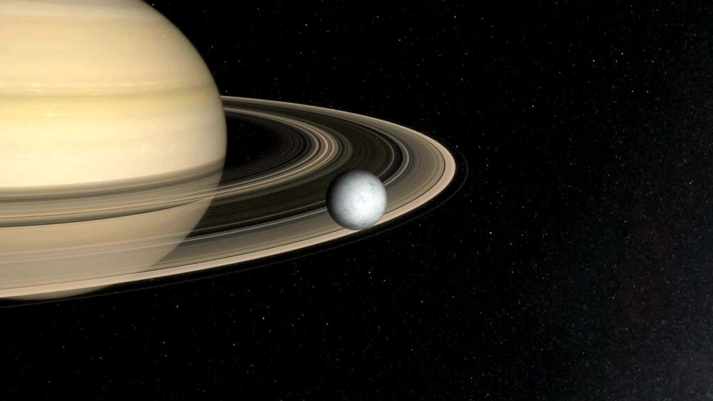 Saturn's Iconic Rings & Moon: Stunning Cosmic Wallpaper Background