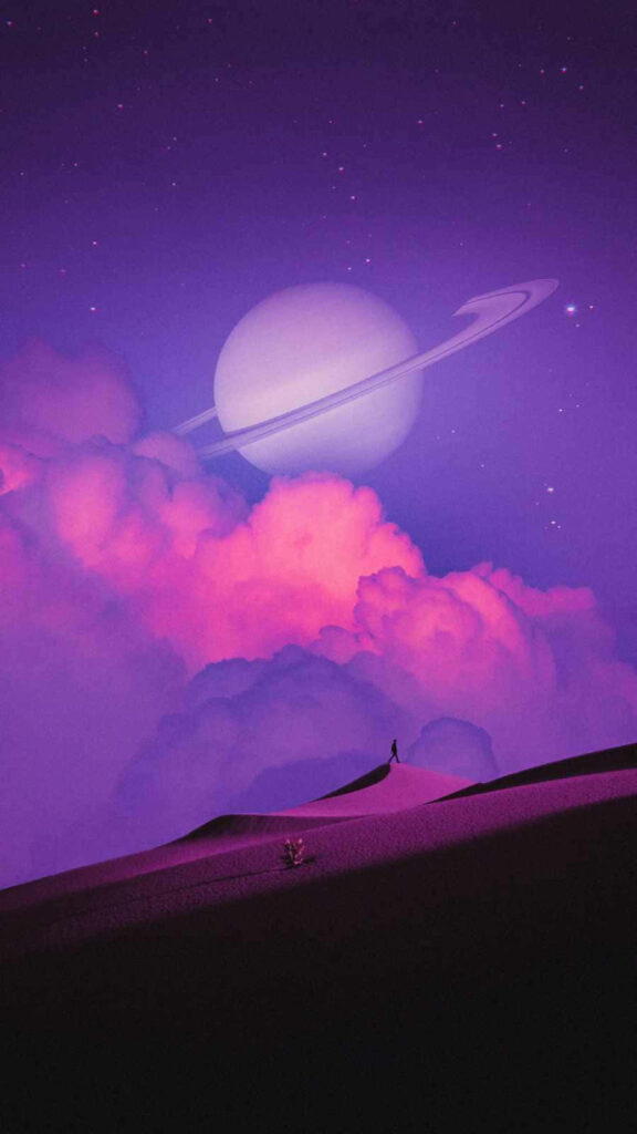 Stunning Saturn and Rings Over Dreamy Purple Landscape Wallpaper
