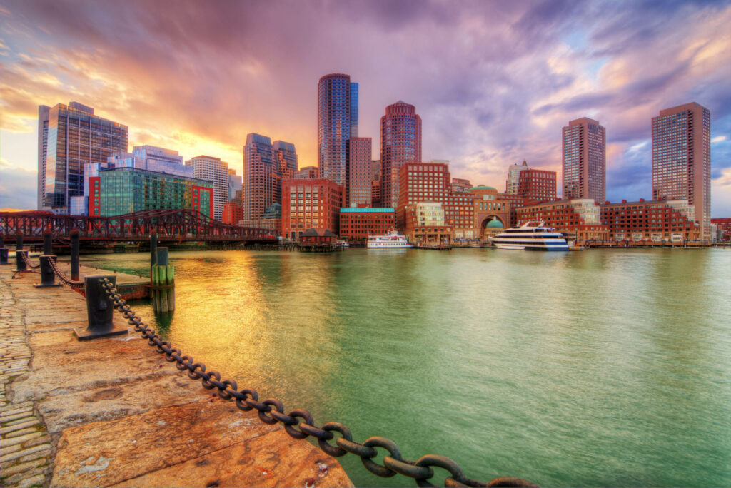 Seaside Pier & Cityscape Sunset Wallpaper: Serene Waterfront View