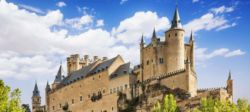 Majestic Segovia Castle Wallpaper: Historic Architecture & Scenic Views