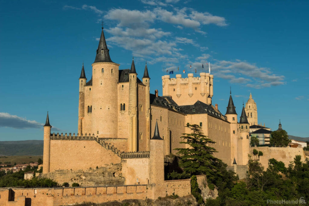 Majestic Segovia Castle Wallpaper: Iconic Towers & Lush Greenery