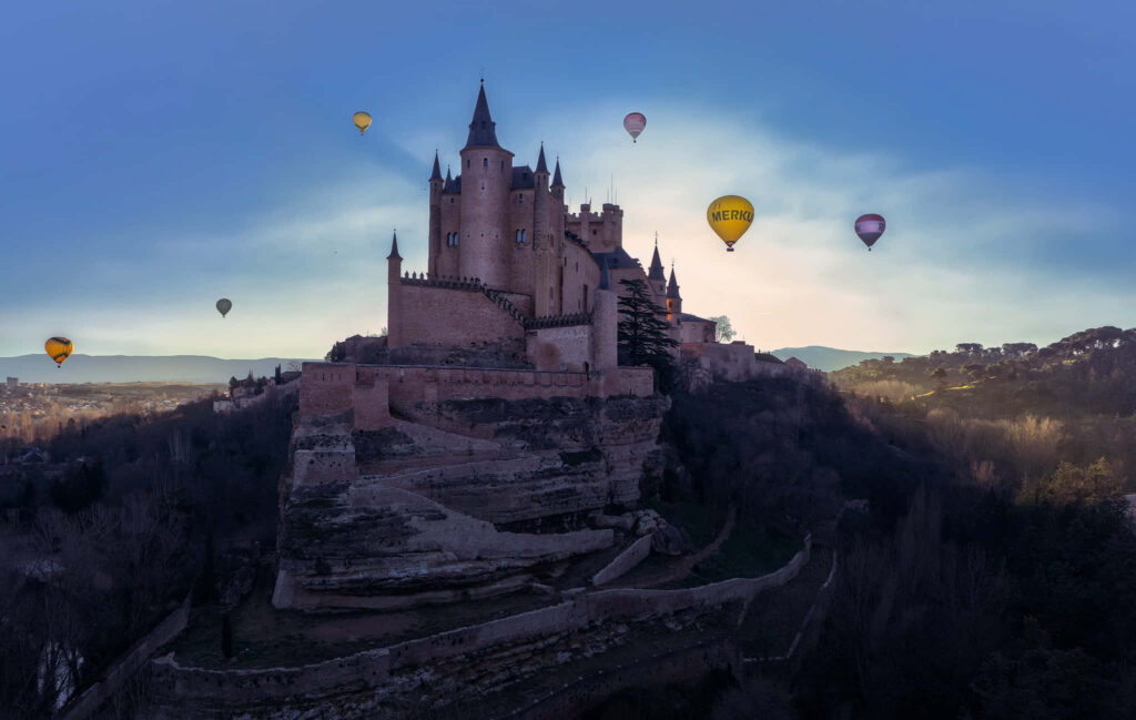 Magical Segovia Castle Wallpaper with Hot Air Balloons - Scenic Views