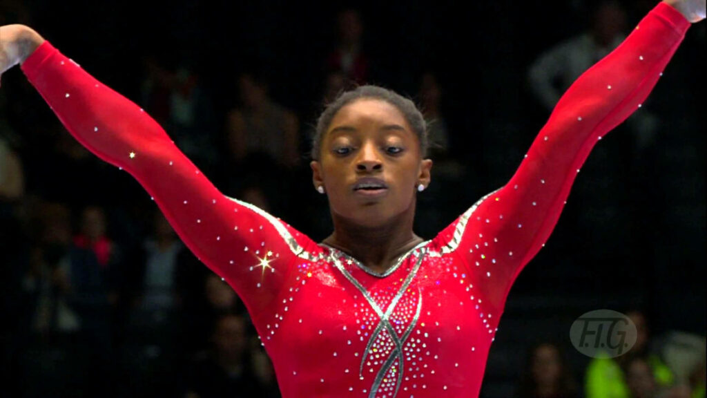 Simone Biles Stunning Red Performance Outfit Wallpaper Background