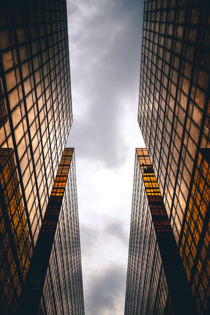 Symmetrical Skyscrapers with Golden Facades - Modern Wallpaper Background