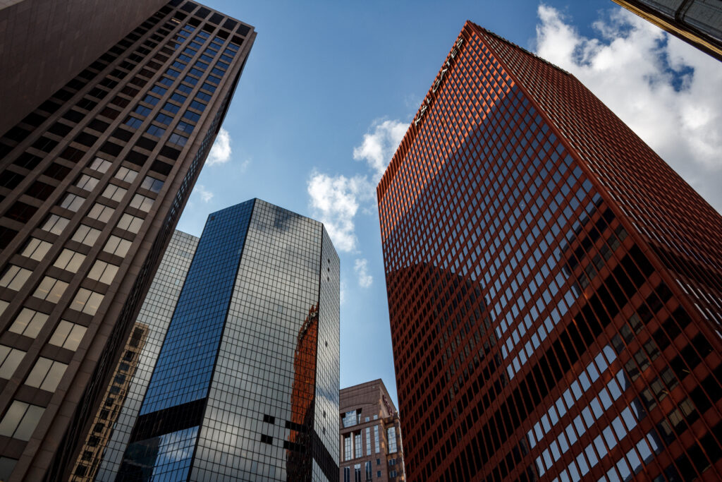 Stunning Skyscraper Wallpaper: Modern Architecture & Blue Sky Background