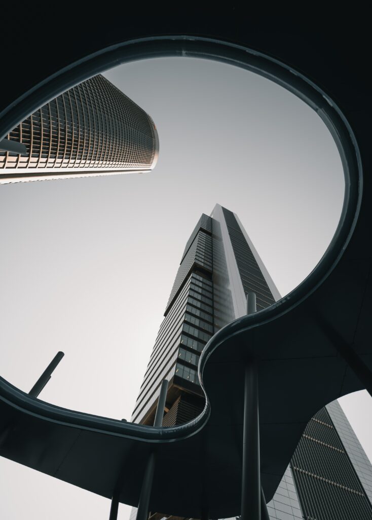 Stunning Skyscraper Wallpaper: Bottom-Up View Against Serene Sky