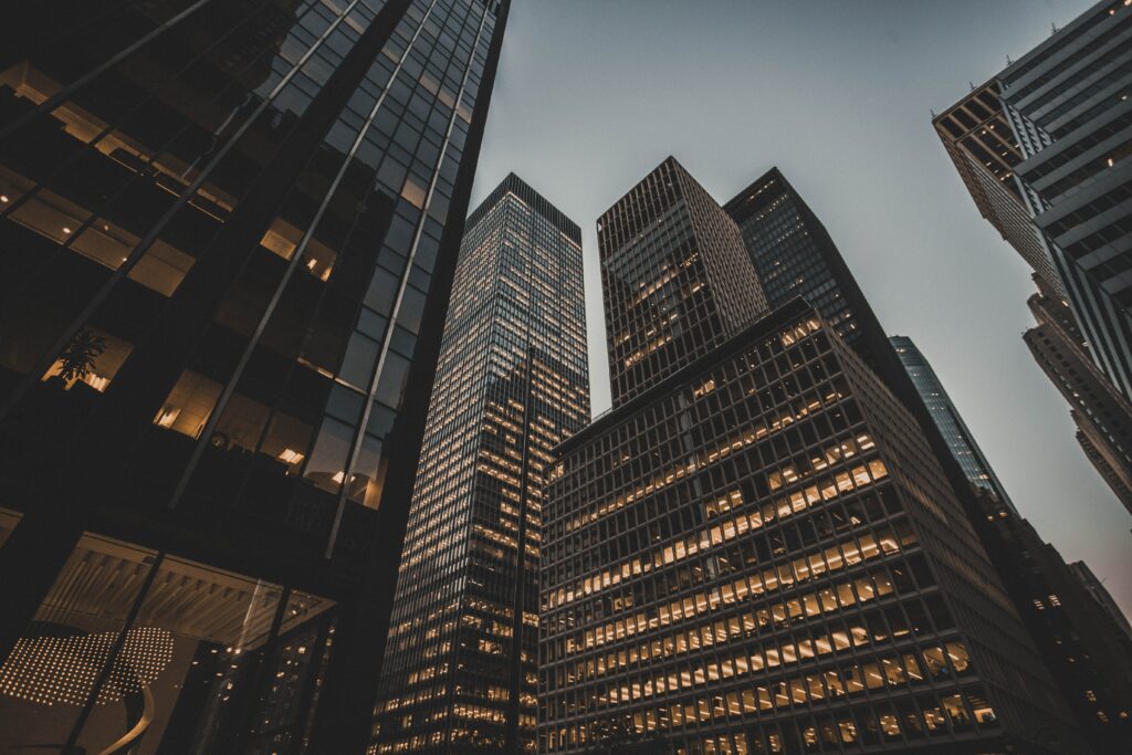 Stunning Skyscrapers Wallpaper: Illuminated Facades & Dusky Sky