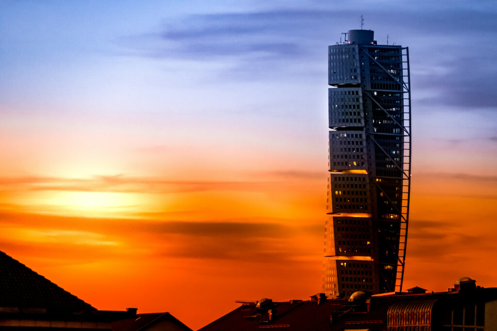 Vibrant Sunset Wallpaper: Modern Skyscraper & Urban Rooftops