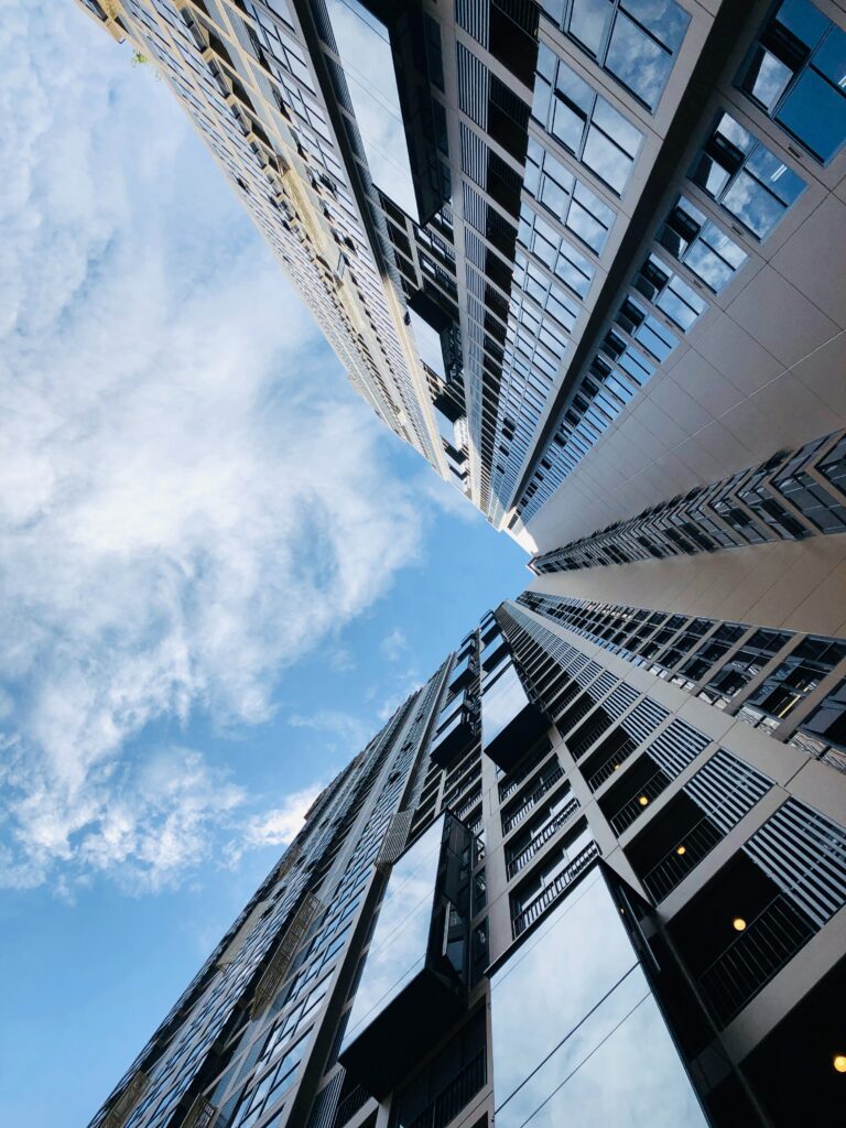 Stunning Modern Skyscraper Wallpaper Against Vibrant Blue Sky