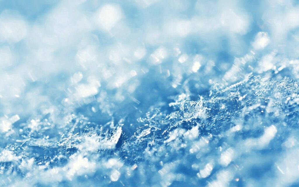 Stunning Snow-Covered Wallpaper with Shimmering Ice Crystals