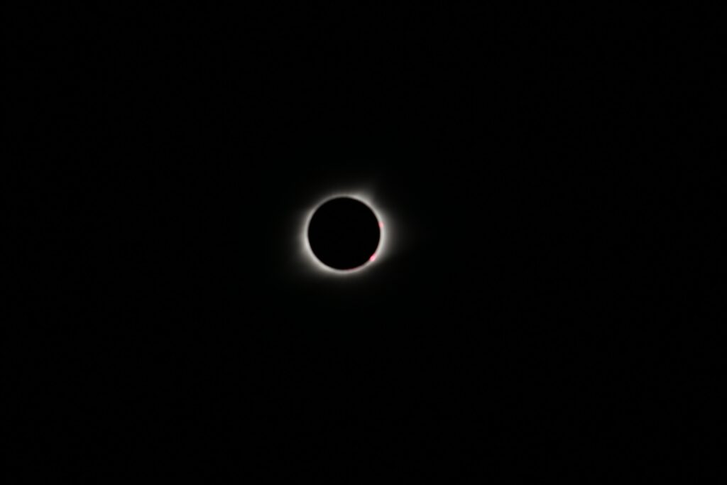 Stunning Solar Eclipse Wallpaper: Moon & Sun Over Cosmic Background