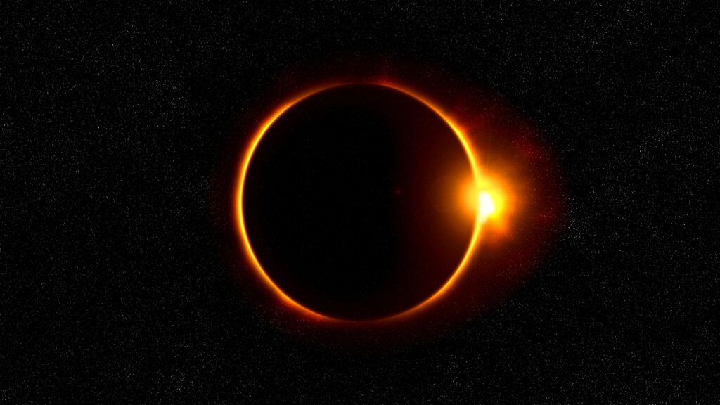 Stunning Solar Eclipse Wallpaper: Moon Obscures Sun with Radiant Halo