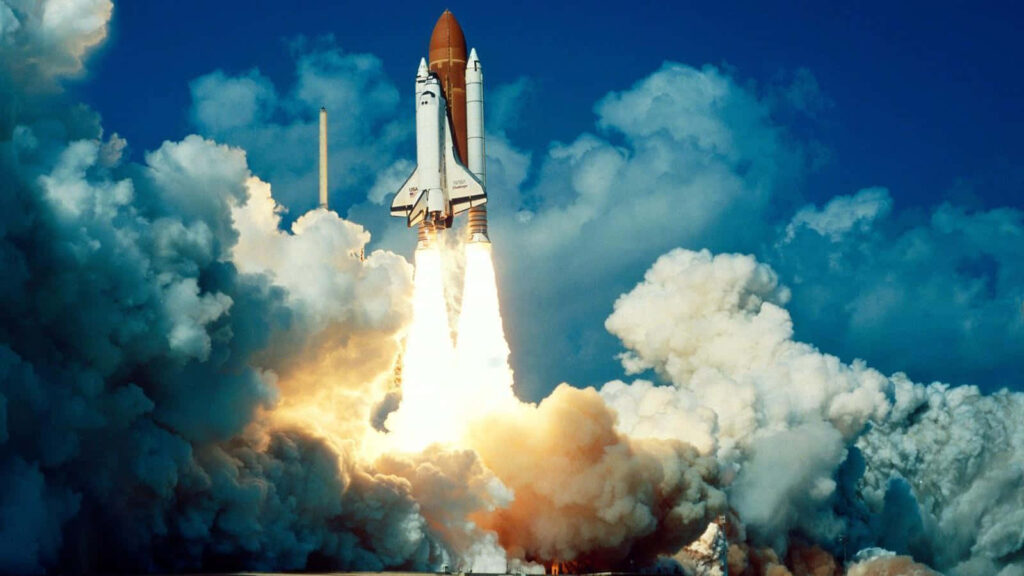 Stunning Space Shuttle Launch Wallpaper: Vibrant Blue Sky & Smoke Trails