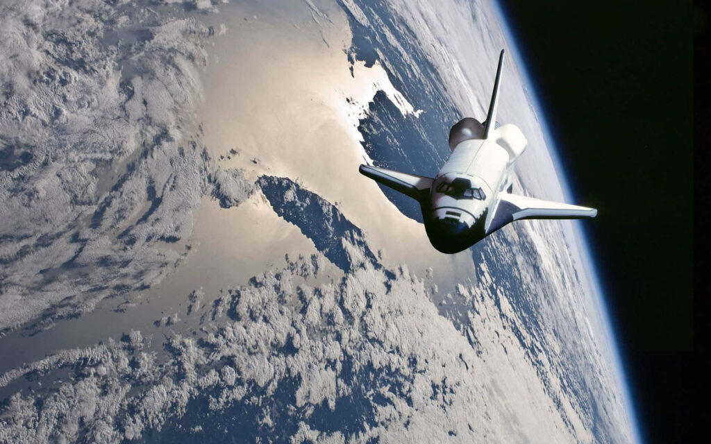 Breathtaking Space Shuttle Wallpaper: Earth Illuminated by Sunlight