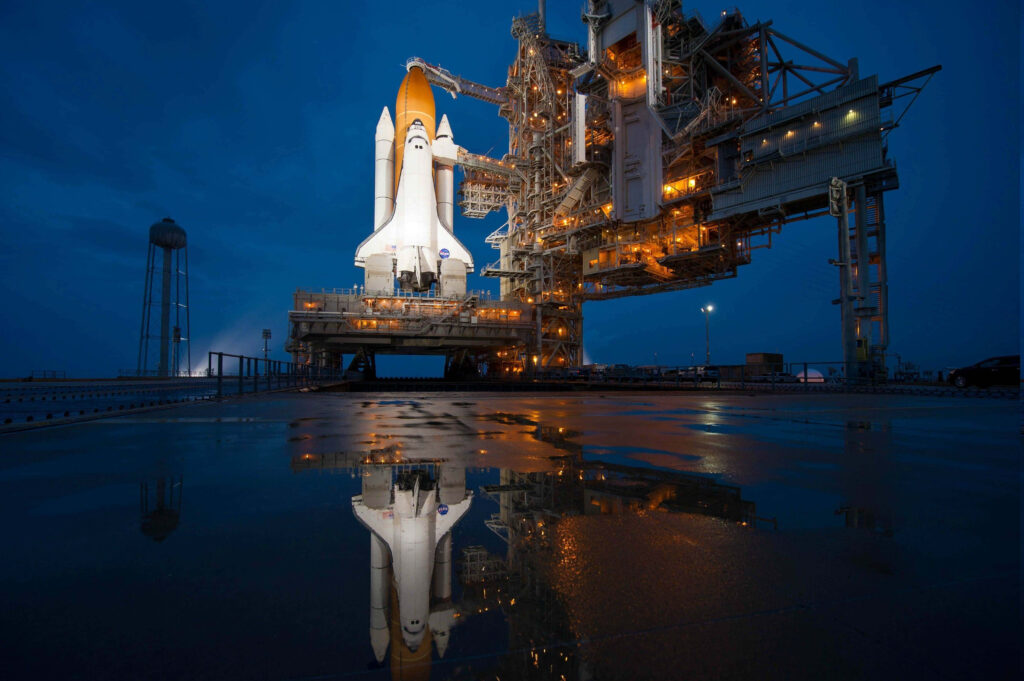 Iconic Space Shuttle Launch Pad Wallpaper Background at Night