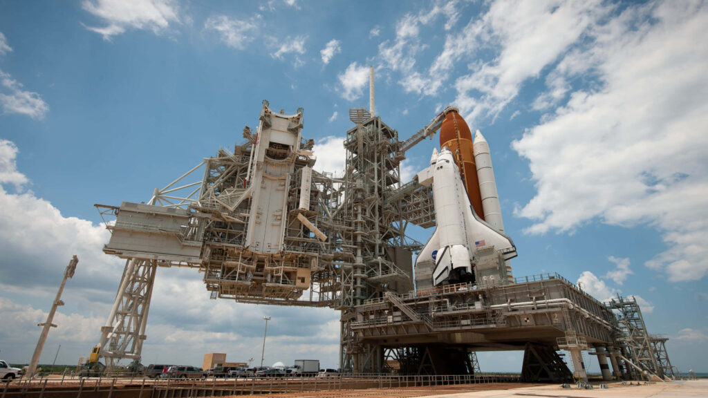 Stunning Space Shuttle Wallpaper: Launch Pad Under Bright Blue Sky
