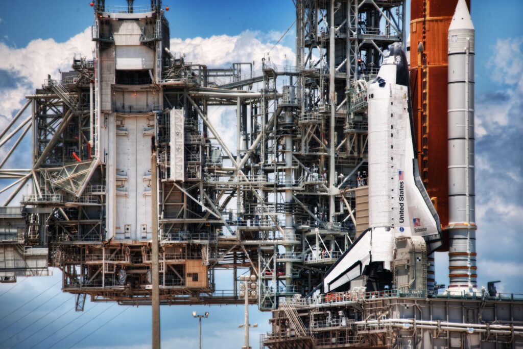 Space Shuttle Launch Pad Wallpaper: Detailed Tech & Dramatic Clouds