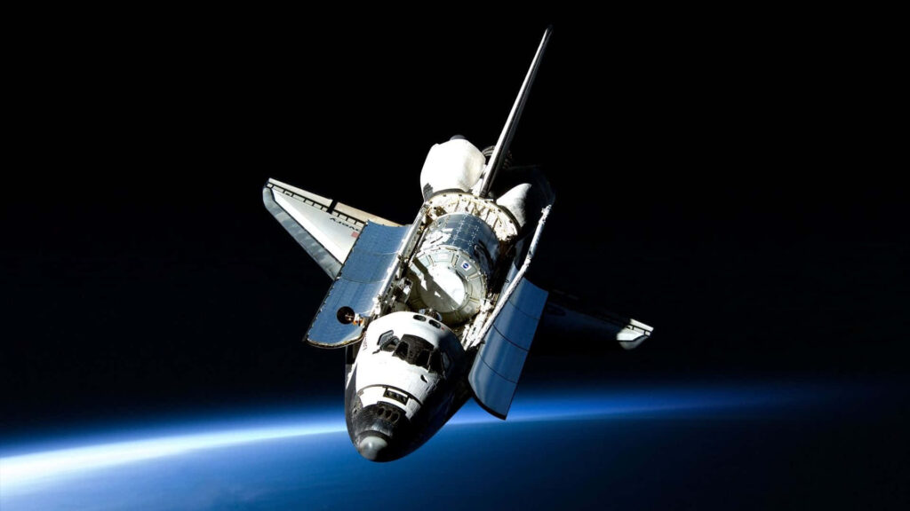 Stunning Space Shuttle Wallpaper: Orbiting Earth with Open Cargo Bay