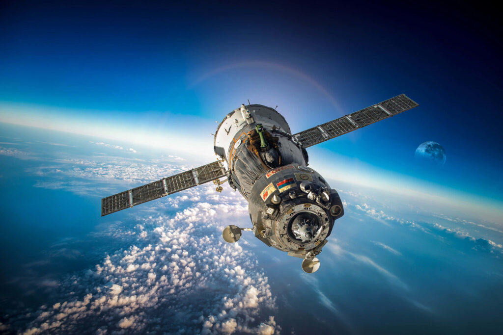 Stunning Space Station Orbiting Earth with Moon Wallpaper Background