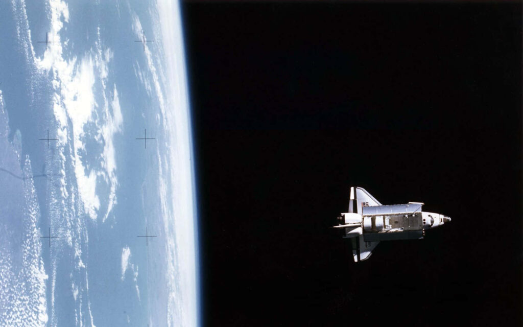 Stunning Space Wallpaper: Earth Orbiting Craft in Cosmic Beauty