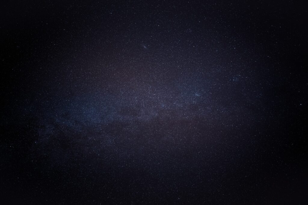 Stunning Cosmic Wallpaper: Stars Against a Dark Space Background