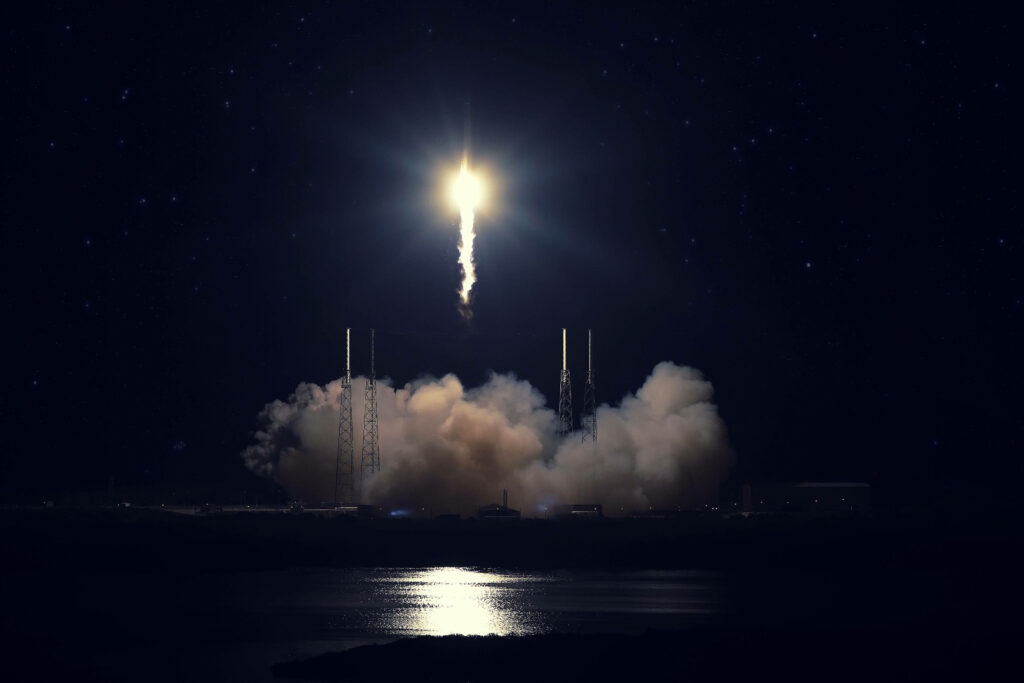 Stunning SpaceX Rocket Launch Wallpaper: Night Sky Glow & Stars