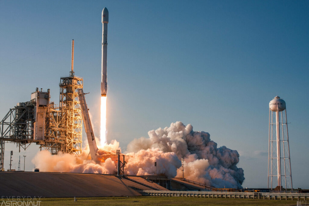 Stunning SpaceX Rocket Launch Wallpaper with Dramatic Clouds