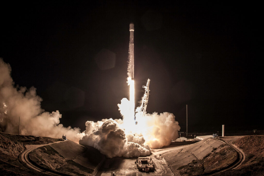 Stunning SpaceX Rocket Launch Wallpaper: Night Sky & Luminous Smoke