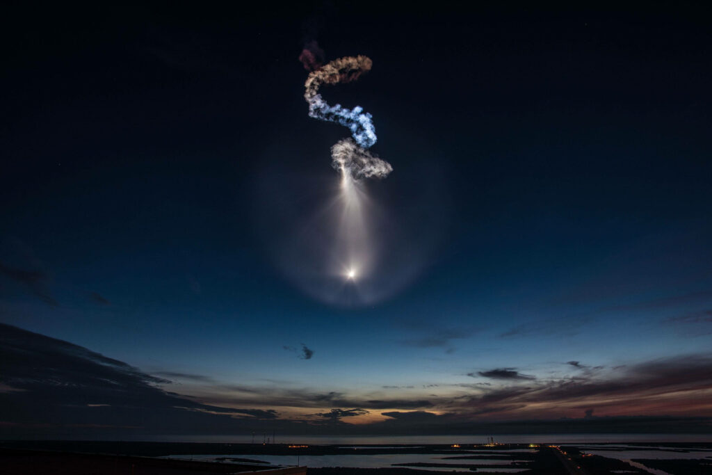 SpaceX Rocket Long-Exposure: Illuminated Twilight Wallpaper Background