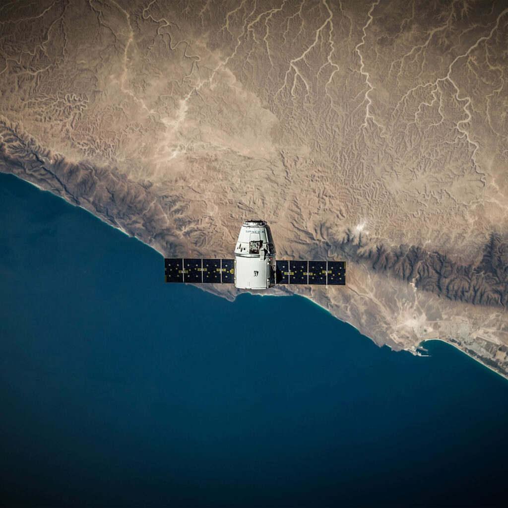Stunning Spacecraft View: Ocean & Coastline Wallpaper Background
