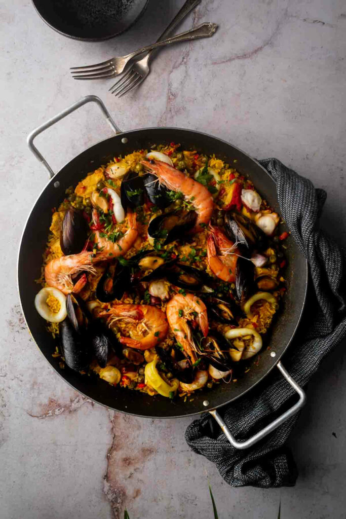 Vibrant Spanish Paella Wallpaper: Saffron Rice, Prawns & Mussels