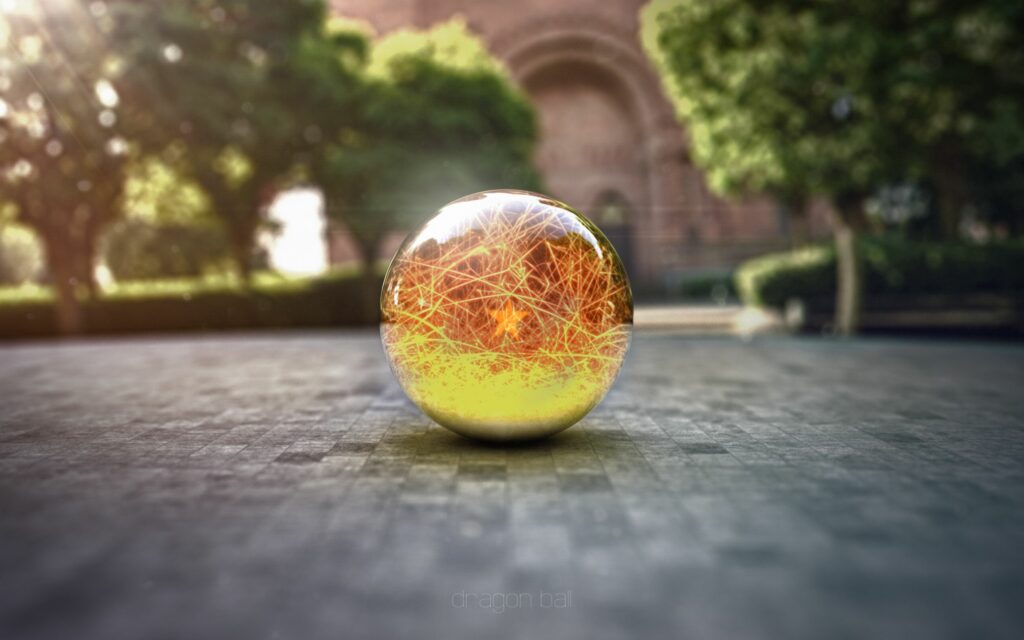 Intricate Spherical Glass Ball on Tiled Surface with Soft Outdoor Background Wallpaper