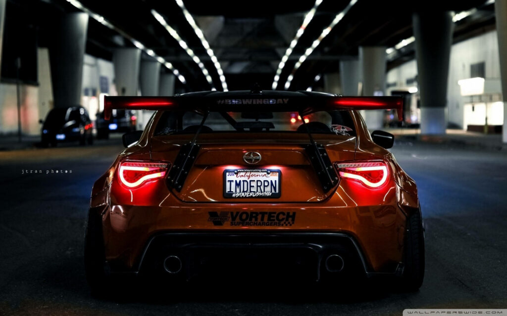 Dynamic Subaru Sports Car Wallpaper: Aggressive Design in Urban Setting