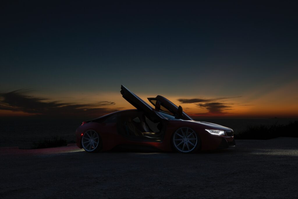 Sleek Sports Car at Sunset: Luxury Wallpaper for Car Enthusiasts