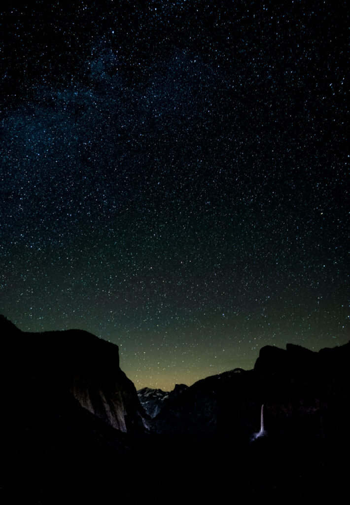 Stunning Starry Night Wallpaper Over Majestic Mountain Range