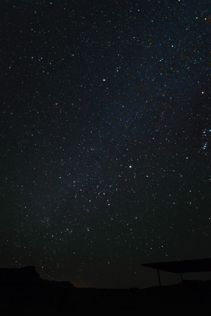 Starlit Sky Wallpaper: Serene Building Silhouette with Sparkling Stars