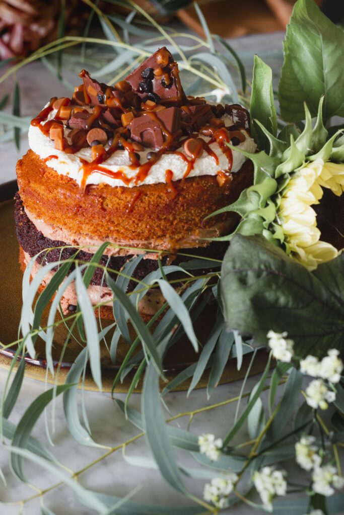 Stunning Layered Cake Still Life with Chocolate, Caramel & Flowers Wallpaper