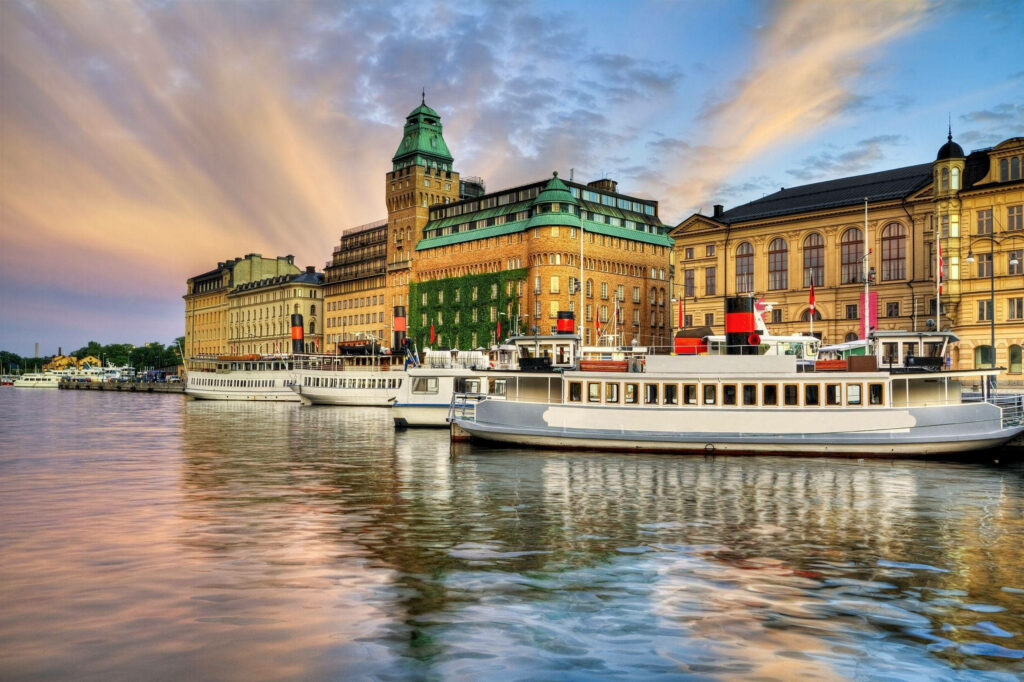 Scenic Stockholm Waterfront: Boats & Historic Architecture Wallpaper