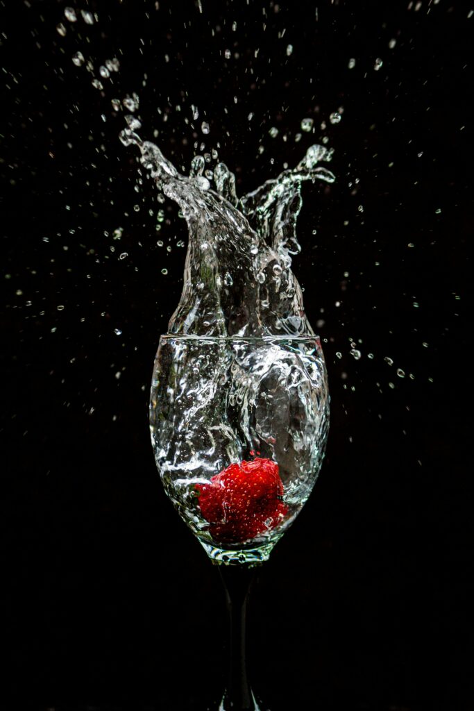 Vibrant Strawberry Splash in Water Wallpaper - High-Res 3456x5184