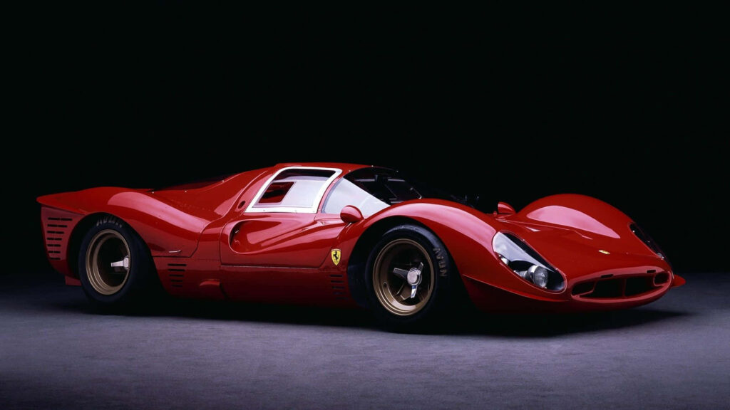 Exquisite Studio Capture: Red-Hot Ferrari 330 Sports Car Bejeweling a Captivating Backdrop Wallpaper